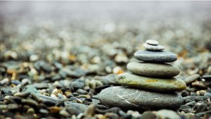 A stack of stones sitting on top of gravel.