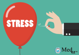 A hand holding a red balloon with the word stress on it.