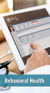 A person using a tablet with medical software solutions displayed for behavioral health.